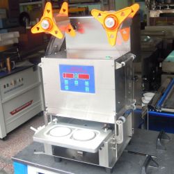 Automatic two trays sealing machine capping machine